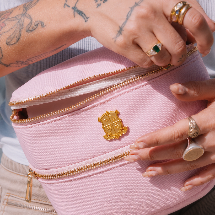 Hands opening the belt bag